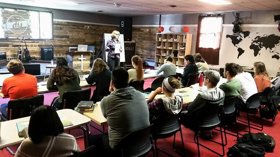Ministry workshop with participants gathered around tables
